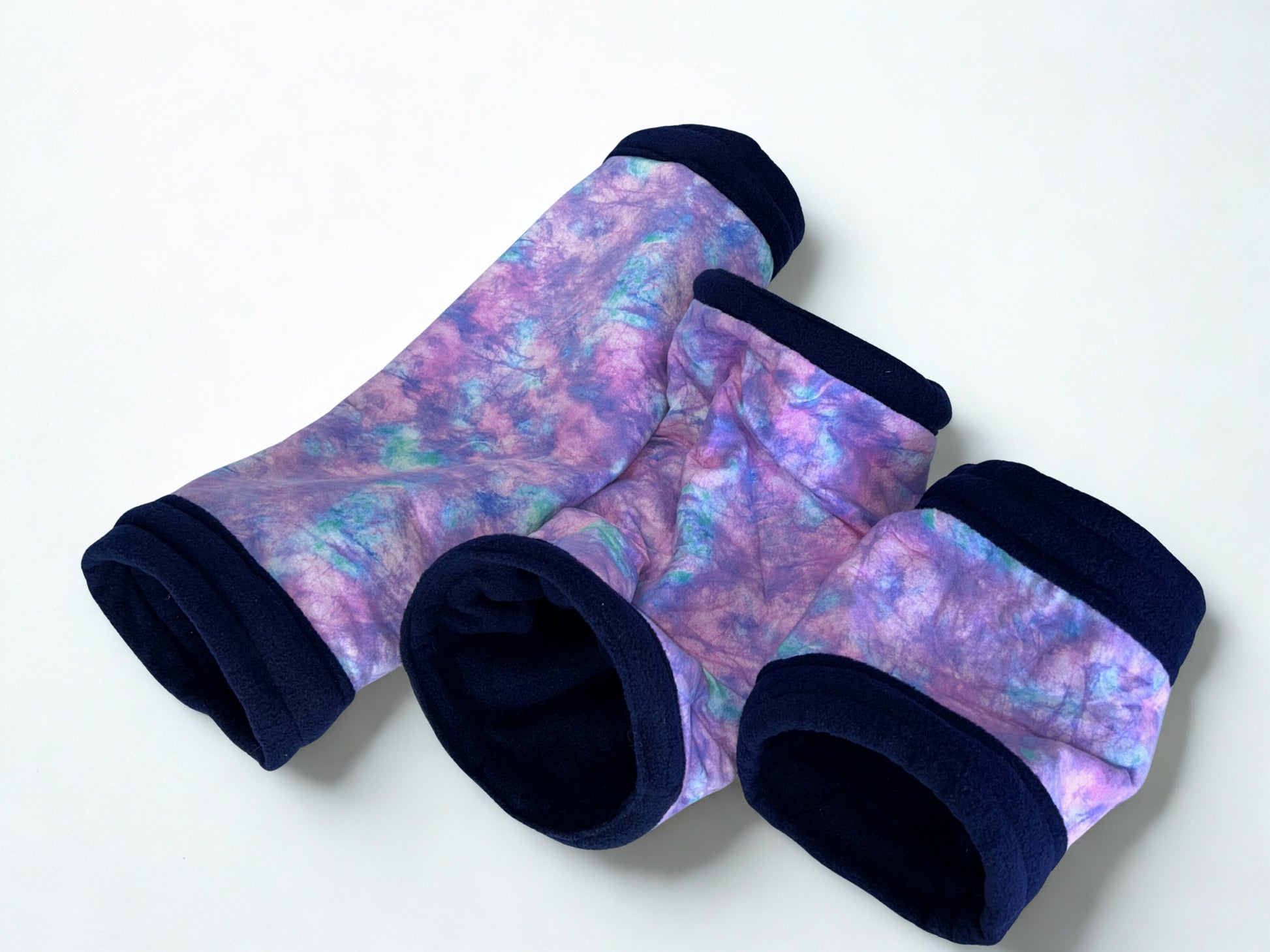 Three size tunnel options; small, medium and large.  All in a tie-dye pattern with navy blue cuffs